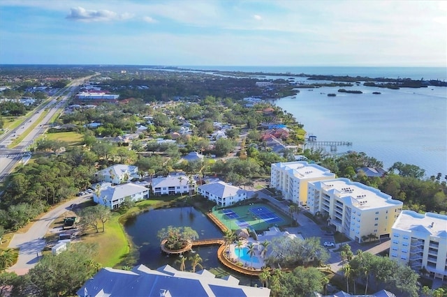 birds eye view of property with a water view