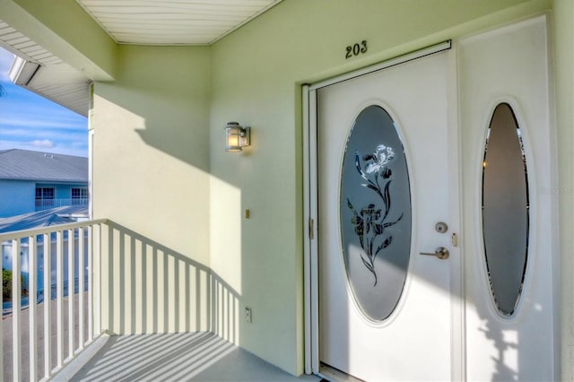 294 Hidden Bay Dr Unit 203, Osprey, FL 34229 - doorway to property with stucco siding and a balcony