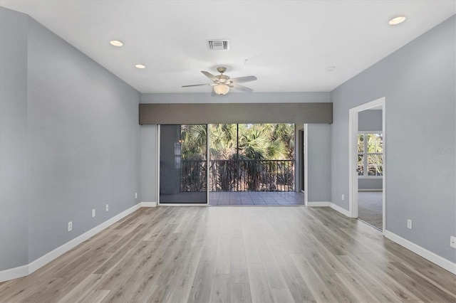 spare room with ceiling fan and light hardwood / wood-style floors