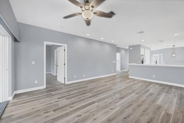294 Hidden Bay Dr Unit 203, Osprey, FL 34229 - unfurnished living room with ceiling fan, light wood-style floors, healthy amount of natural light, and recessed lighting