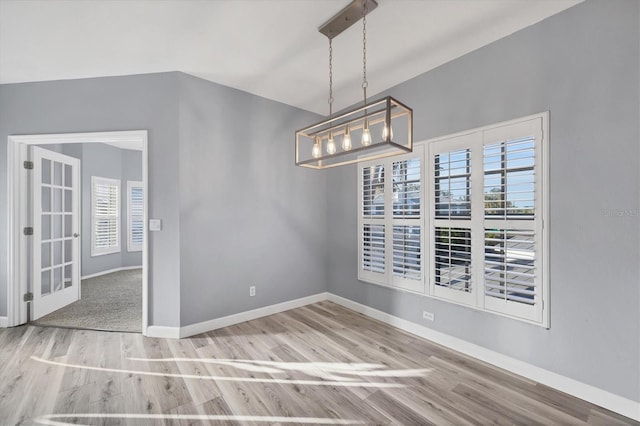 unfurnished dining area with hardwood / wood-style floors