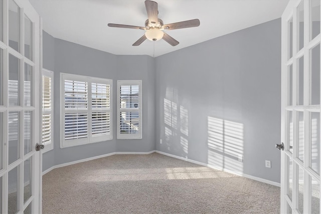 294 Hidden Bay Dr Unit 203, Osprey, FL 34229 - unfurnished room featuring french doors, carpet, and a ceiling fan