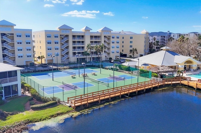 view of sport court with a water view