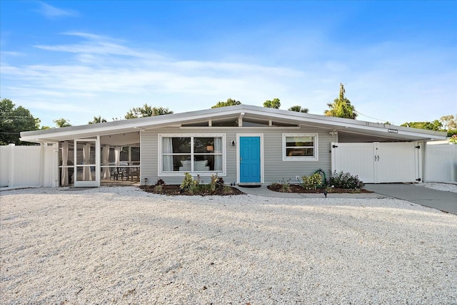 view of front of property featuring a carport