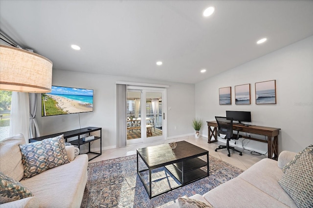 tiled living room with plenty of natural light and vaulted ceiling