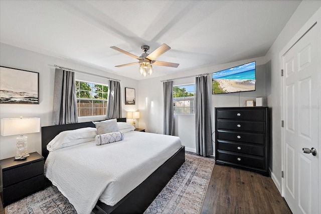 bedroom featuring ceiling fan and dark hardwood / wood-style flooring