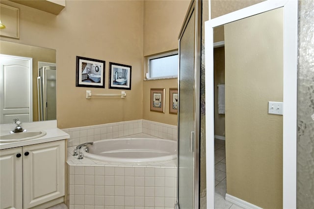 bathroom with vanity, tile patterned floors, and separate shower and tub