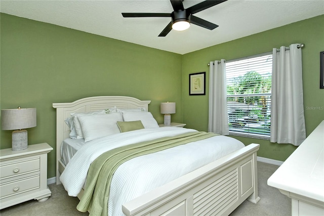 bedroom with light colored carpet and ceiling fan