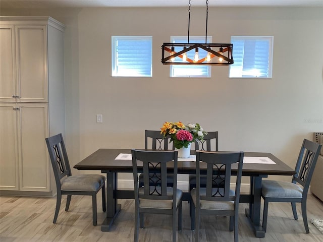 dining area with light hardwood / wood-style floors