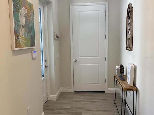 doorway to outside with light hardwood / wood-style flooring