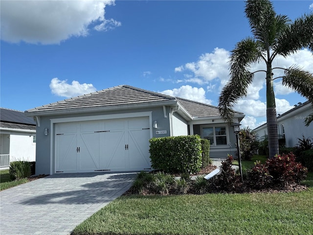 view of front of property with a garage