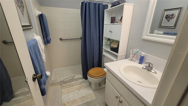 bathroom featuring toilet, vanity, and walk in shower