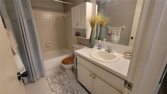 full bathroom with shower / bath combo with shower curtain, tile patterned flooring, vanity, and toilet