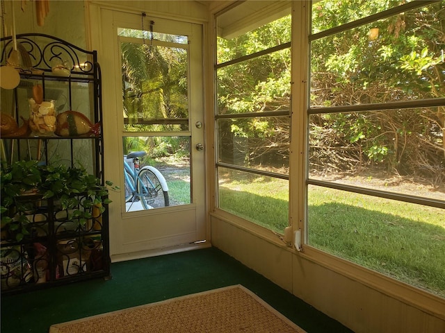 unfurnished sunroom featuring a wealth of natural light