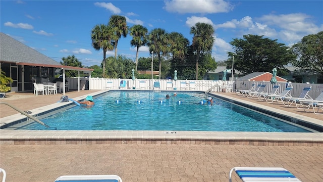 view of swimming pool featuring a patio