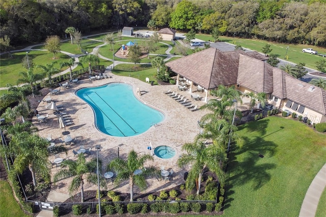 view of pool with a lawn and a patio area