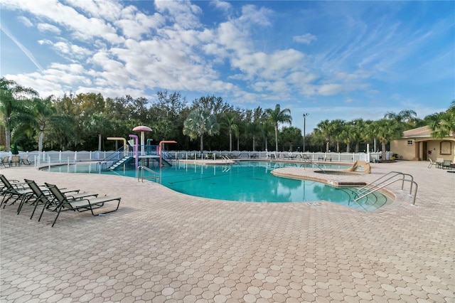 view of swimming pool featuring a patio area