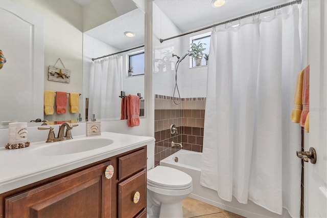 full bathroom with vanity, tile patterned flooring, shower / bath combo, and toilet