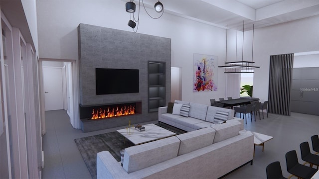 living room featuring a fireplace and a high ceiling