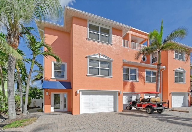 467 Canal Rd Unit 467, Sarasota, FL 34242 - view of front facade featuring a garage, stucco siding, and driveway