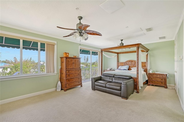 467 Canal Rd Unit 467, Sarasota, FL 34242 - bedroom with access to outside, carpet, multiple windows, baseboards, and crown molding