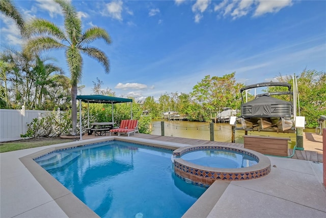 467 Canal Rd Unit 467, Sarasota, FL 34242 - view of swimming pool featuring a pool with connected hot tub and a water view