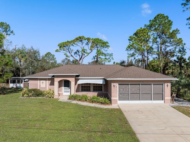 ranch-style home featuring a front yard and a garage