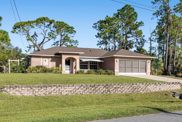 ranch-style house featuring a garage and a front yard