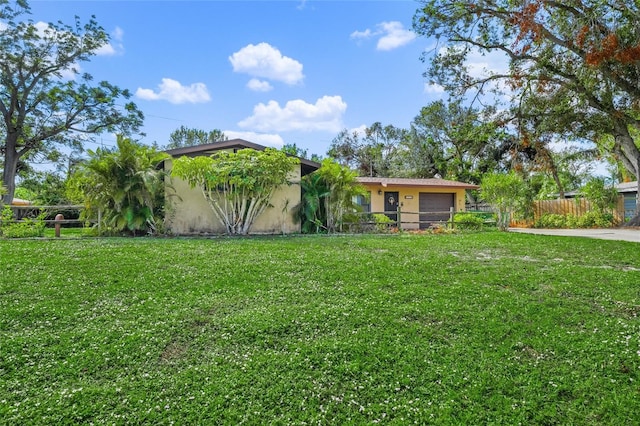 exterior space featuring a front yard and a garage