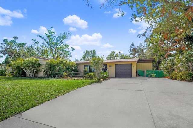 view of front facade featuring a garage and a front lawn