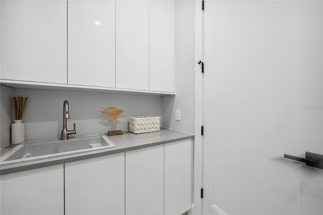 kitchen with white cabinets and sink