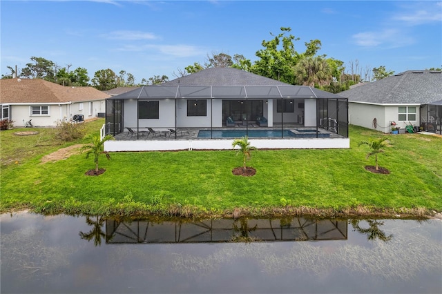 rear view of house featuring a lanai, a lawn, and a patio