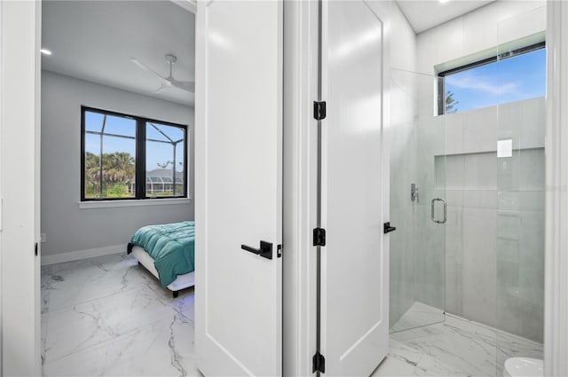 bathroom with baseboards, a stall shower, and marble finish floor