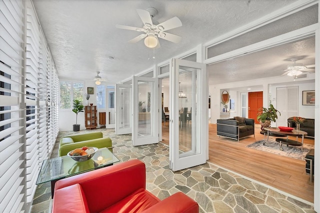 sunroom featuring french doors