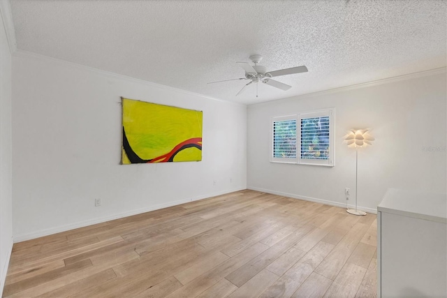 unfurnished room with ceiling fan, a textured ceiling, light hardwood / wood-style flooring, and ornamental molding