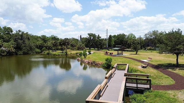 dock area featuring a water view and a yard