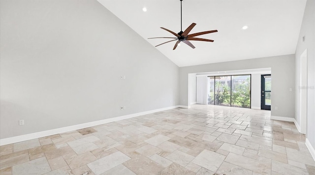 empty room featuring high vaulted ceiling and ceiling fan