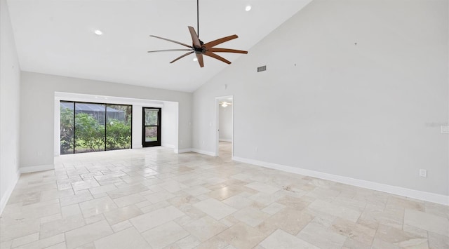 spare room with ceiling fan and high vaulted ceiling