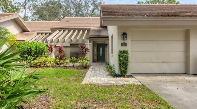 doorway to property with a garage