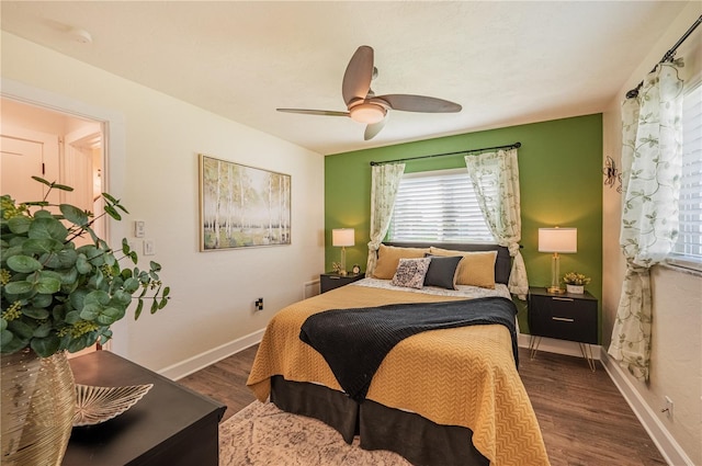 bedroom featuring ceiling fan and dark hardwood / wood-style floors