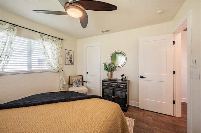 bedroom featuring ceiling fan and dark hardwood / wood-style flooring