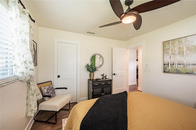 bedroom with ceiling fan and wood-type flooring