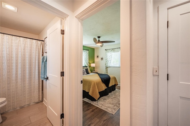 interior space with hardwood / wood-style floors and ceiling fan