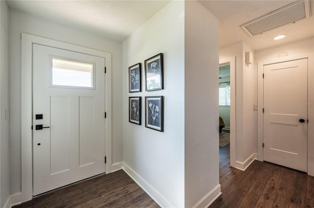 entryway with dark hardwood / wood-style flooring