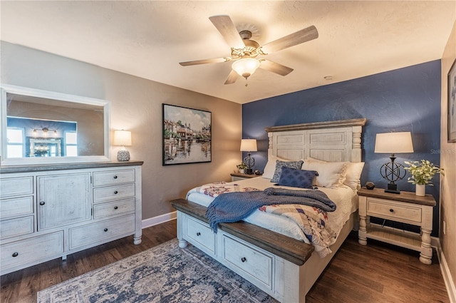 bedroom featuring dark hardwood / wood-style flooring and ceiling fan