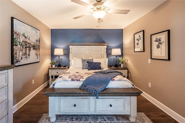 bedroom with dark wood-type flooring and ceiling fan