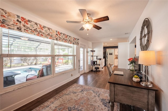 office area featuring dark hardwood / wood-style floors and ceiling fan