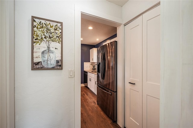 hall with dark hardwood / wood-style flooring