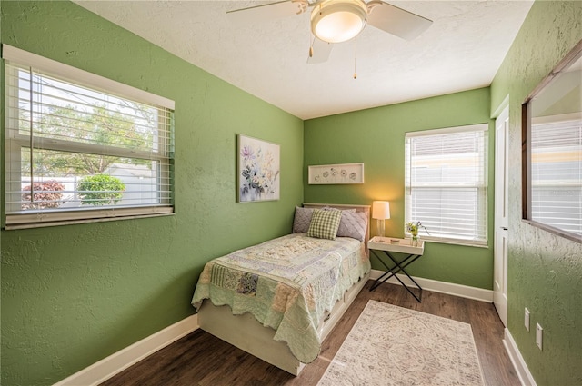 bedroom featuring hardwood / wood-style flooring and ceiling fan