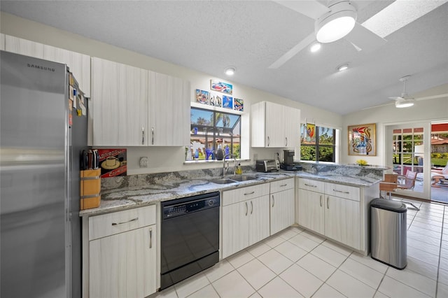 kitchen with dishwasher, kitchen peninsula, stone counters, a textured ceiling, and stainless steel refrigerator